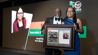  image of Jeanette Boleware receiving Top 50 award 